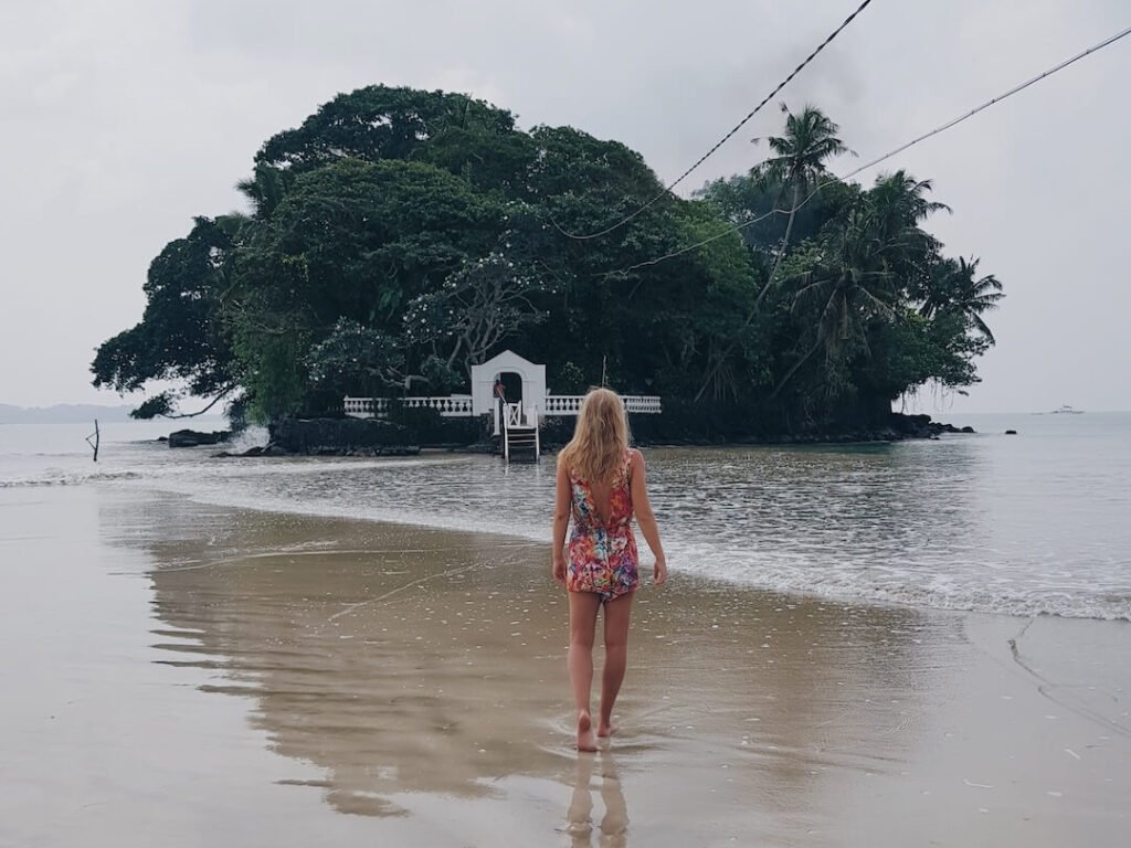 view-from-behind-a-woman-walking-towards-a-tropica-2026-01-05-00-13-05-utc