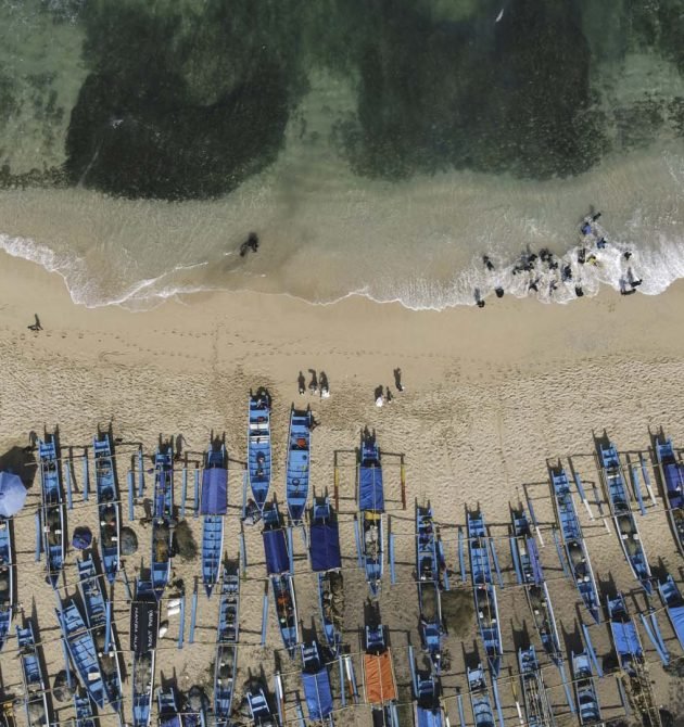 Aerial drone view of Fishermans boats at the beach in Yogyakarta Indonesia.