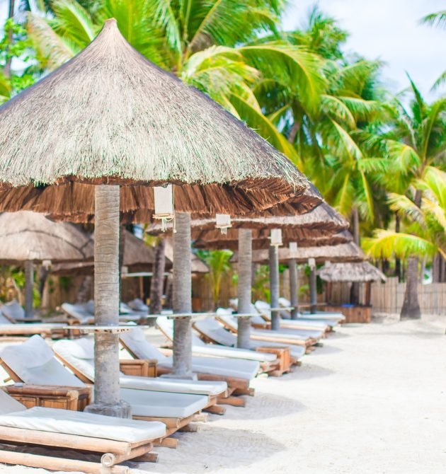 Beach beds on luxury resort on exotic tropical white sandy beach